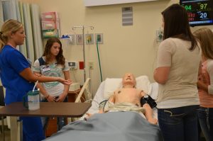 students and instructor in simulation lab
