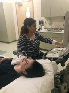 Student uses sonography equipment.