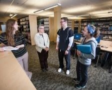 Students talking with the Bellin College librarian.