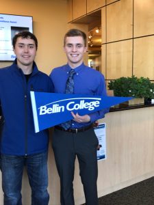 Brothers hold a Bellin College pennant