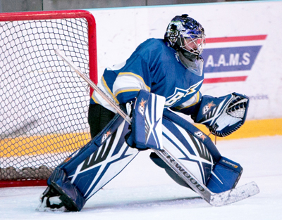 Ice hockey goalie in a ready stance