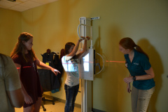 Three students working in the radiology lab