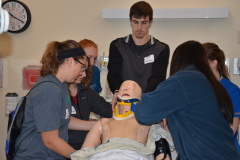 Re-positioning patient that is wearing a neck brace